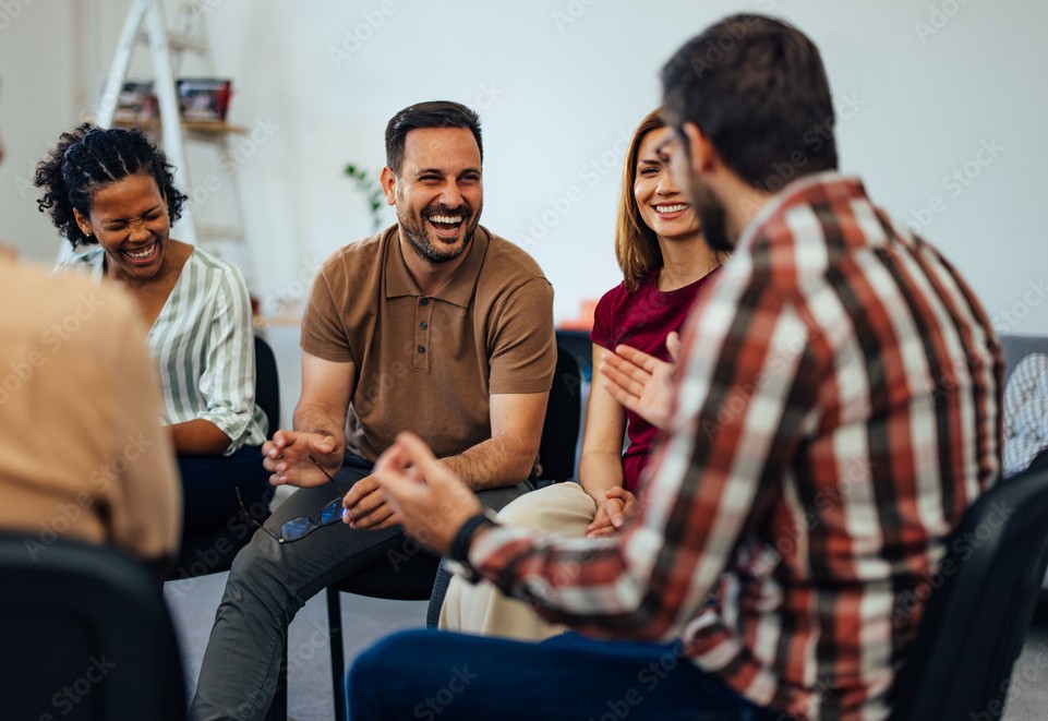 Memphis TN 7 People laughing and talking during a group support session at a Memphis TN suboxone clinic.