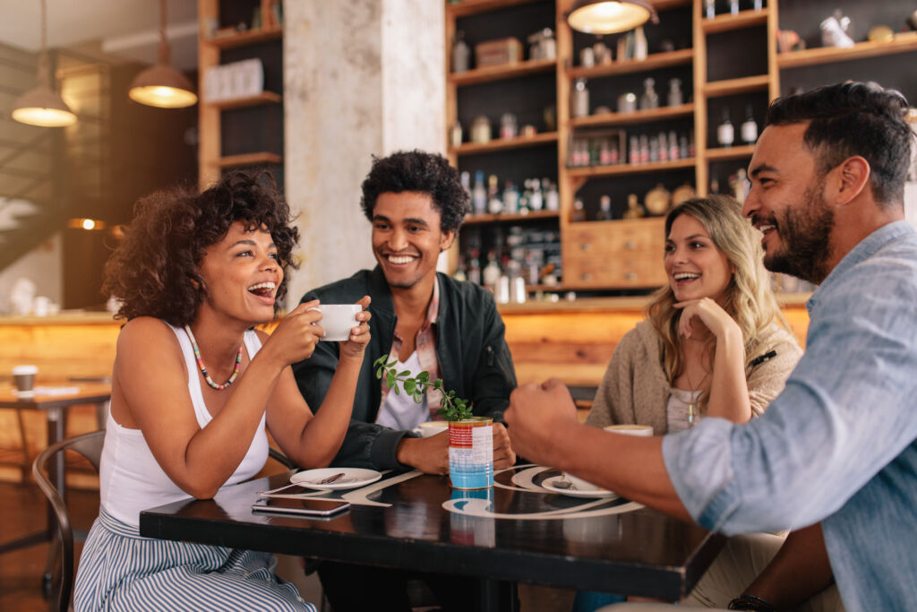 Benefits of methadone treatment featured image - Young friends having a great time in restaurant.