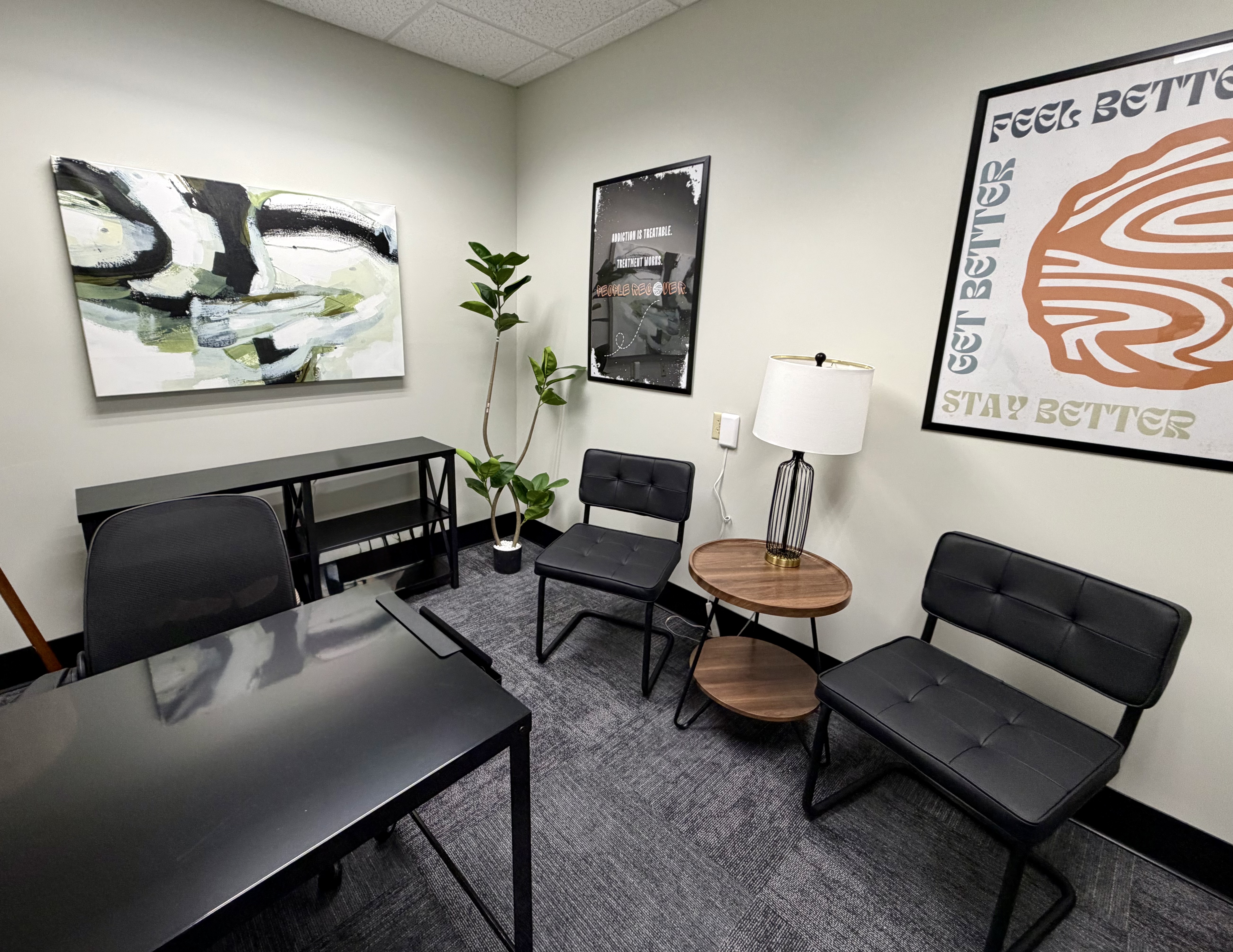 Private behavioral therapy office at Cedar Recovery with chairs, side table, and calming decor.
