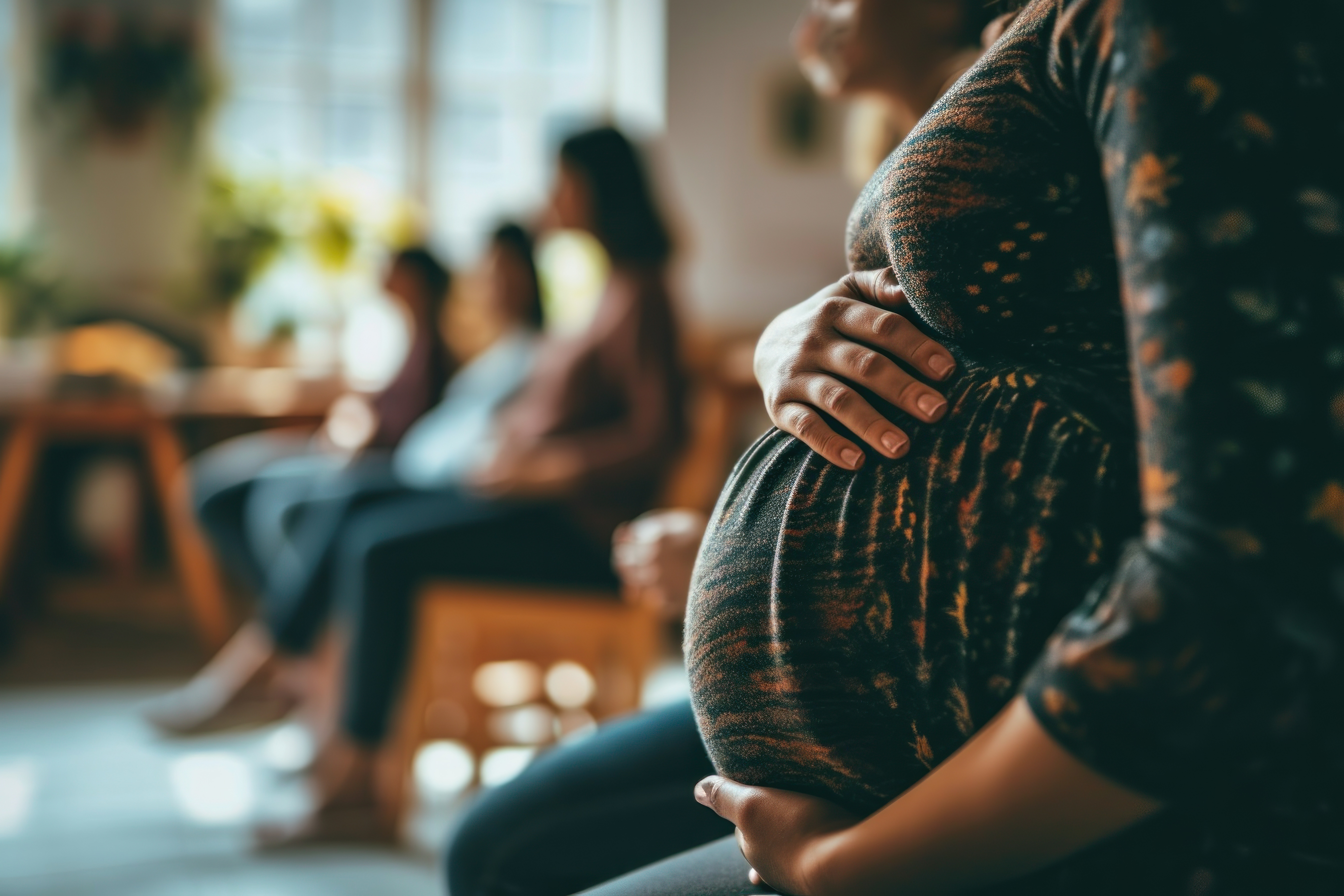 A picture of a happy boy with his pregnant mother.