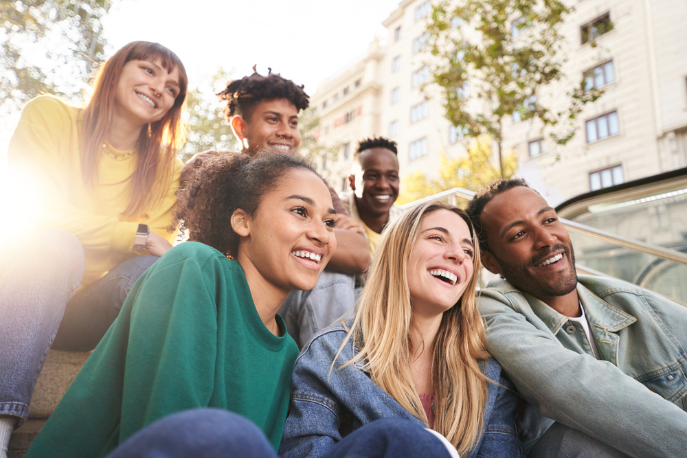 Happy smiling support group for opioid addiction having fun together.