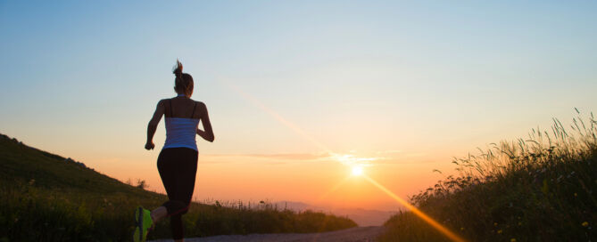 Image alt text: Young woman exercising to enhance mental health and overall well-being.