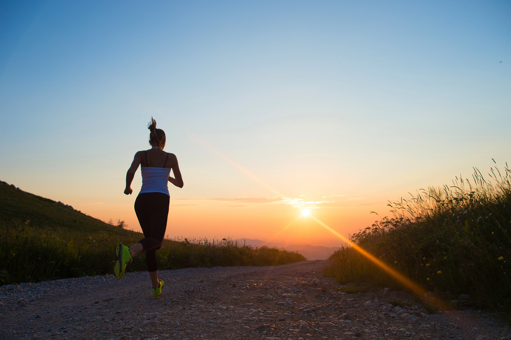 Image alt text: Young woman exercising to enhance mental health and overall well-being.