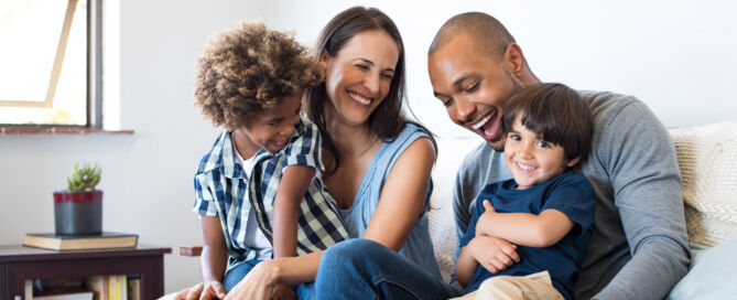High-functioning addicts maintain seemingly normal lives - A happy man with his family having fun at home.