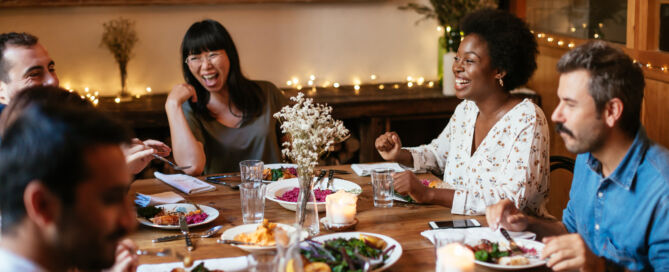 Featured image on how to stay sober while recovering from substance use disorder - Friends dining indoors