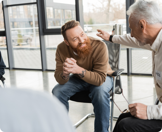 Lebanon 1 Heroin addiction treatment in Tennessee and Virginia, man speaking to a fellow group therapy participant.