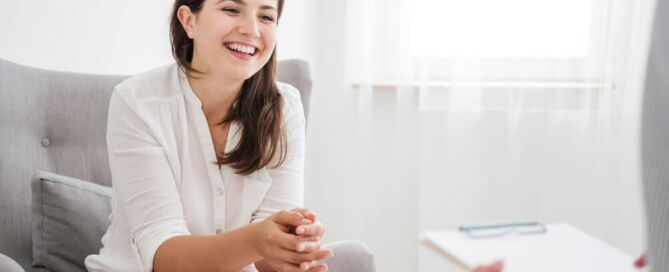 A happy woman undergoing outpatient therapy for mental disorder and drug abuse