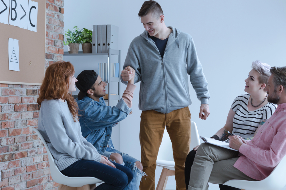 A man finding support from a group therapy for suboxone treatment.